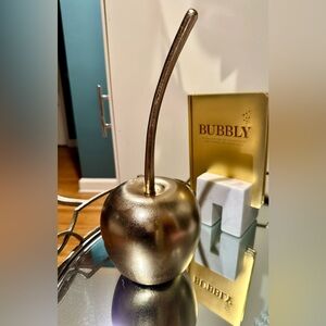 Large gold cherry sculpture
